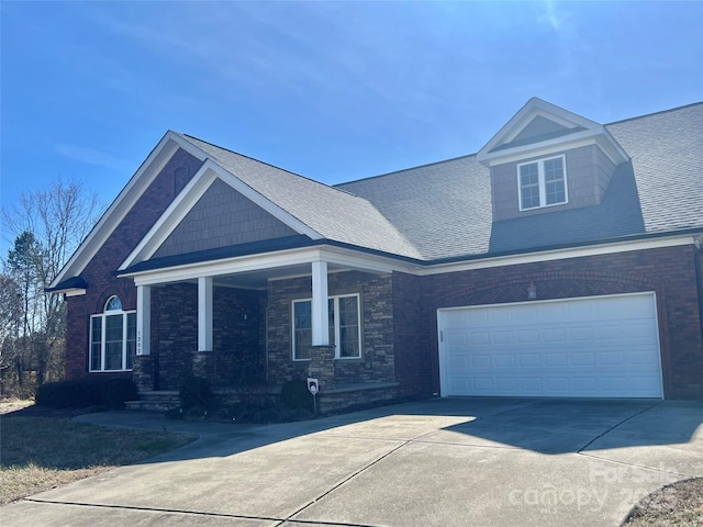 view of front of home with a garage and a porch