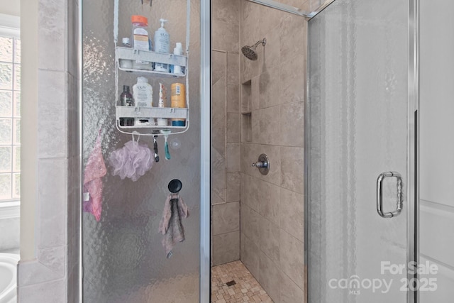 bathroom featuring a stall shower