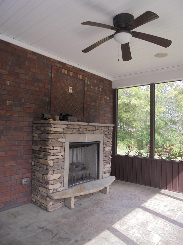 unfurnished living room with a stone fireplace