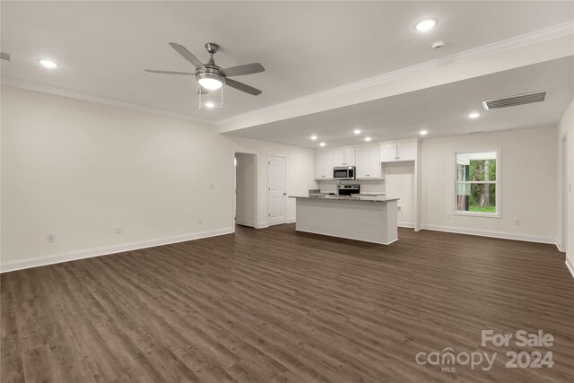 unfurnished living room featuring ceiling fan, dark hardwood / wood-style floors, and crown molding