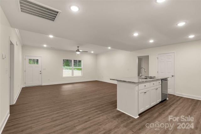 kitchen with dishwasher, sink, white cabinetry, a kitchen island with sink, and dark wood-type flooring