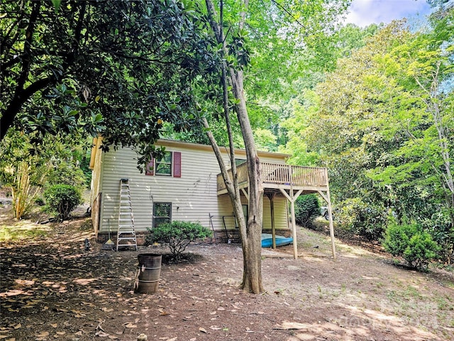 rear view of property with a wooden deck