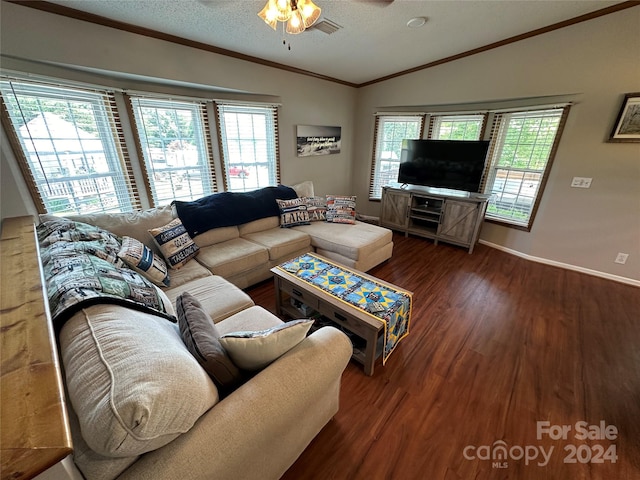 living room with dark wood-type flooring, vaulted ceiling, ceiling fan, ornamental molding, and a textured ceiling