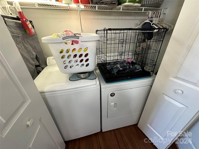 washroom with dark hardwood / wood-style floors and separate washer and dryer