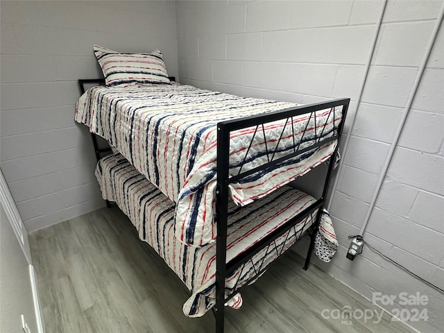 bedroom with wood-type flooring