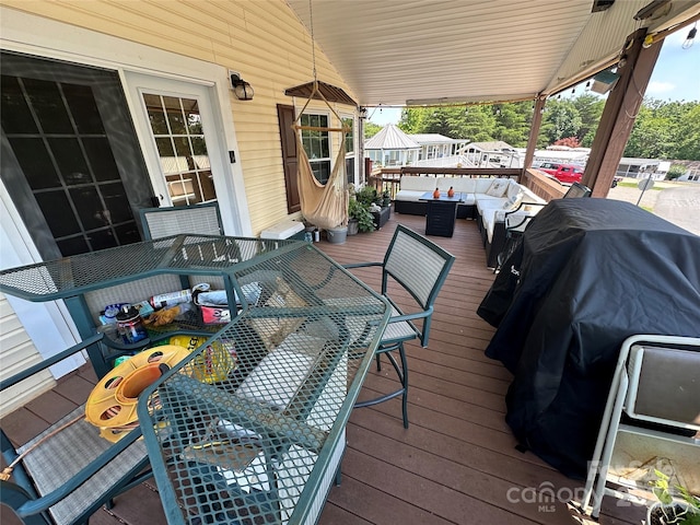 wooden deck featuring an outdoor living space