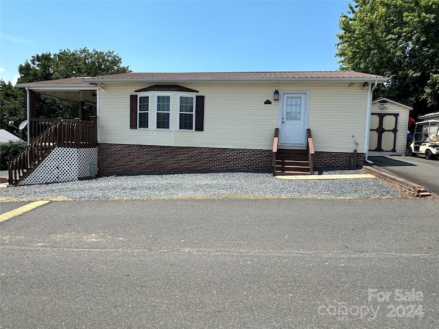 manufactured / mobile home with a storage shed