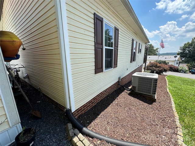 view of side of home with cooling unit