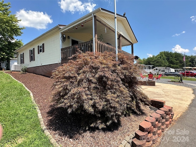 view of side of home with a patio