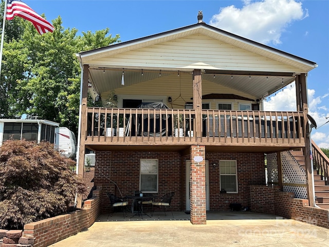 rear view of property with a patio area