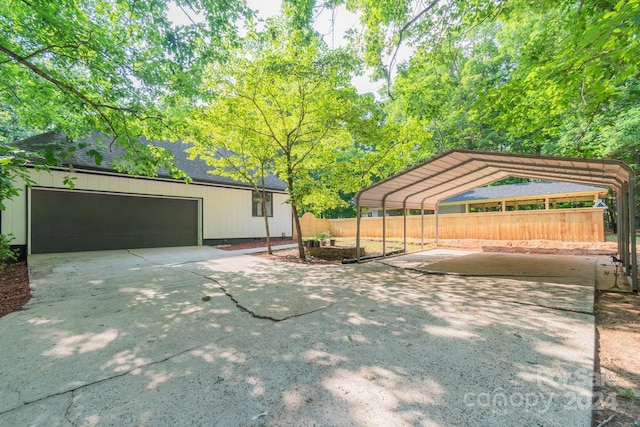 exterior space with a garage and a carport