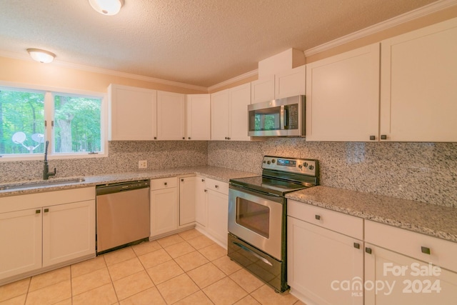 kitchen featuring sink, white cabinetry, and stainless steel appliances