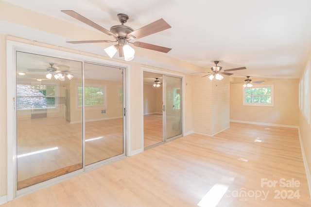 spare room with hardwood / wood-style flooring