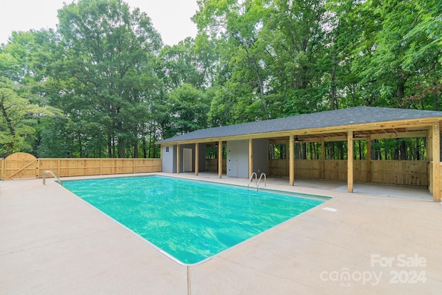 view of swimming pool with a patio area