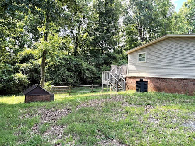 view of yard featuring central AC unit