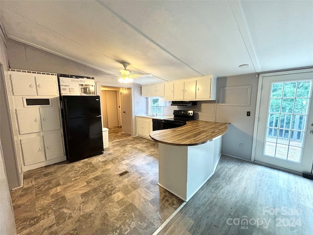 kitchen with kitchen peninsula, ceiling fan, white cabinets, and black appliances