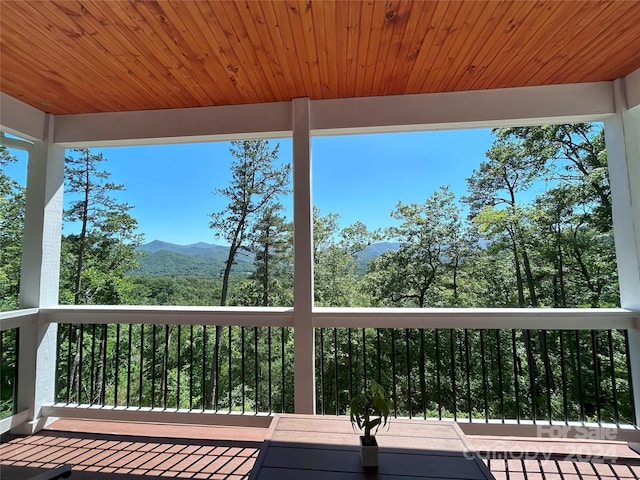 wooden deck featuring a mountain view