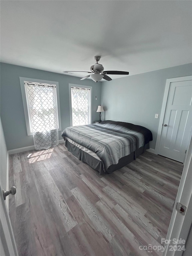 bedroom featuring ceiling fan and hardwood / wood-style floors