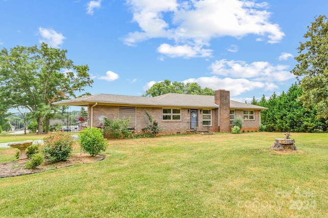 single story home with a front lawn and a patio area