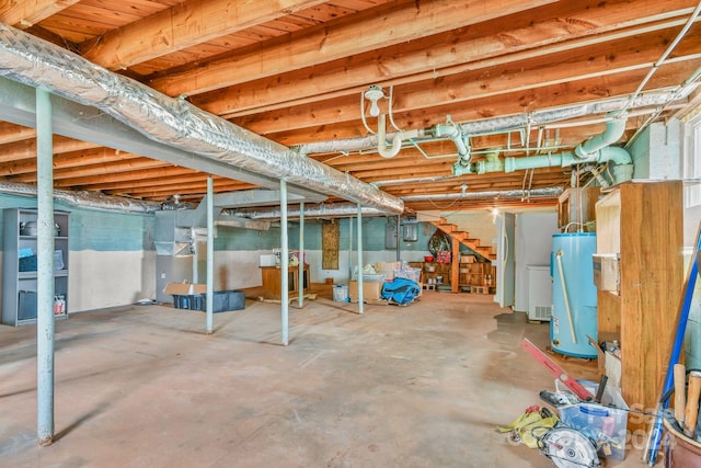 basement with water heater and heating unit