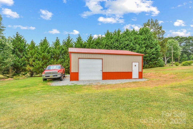 garage featuring a lawn