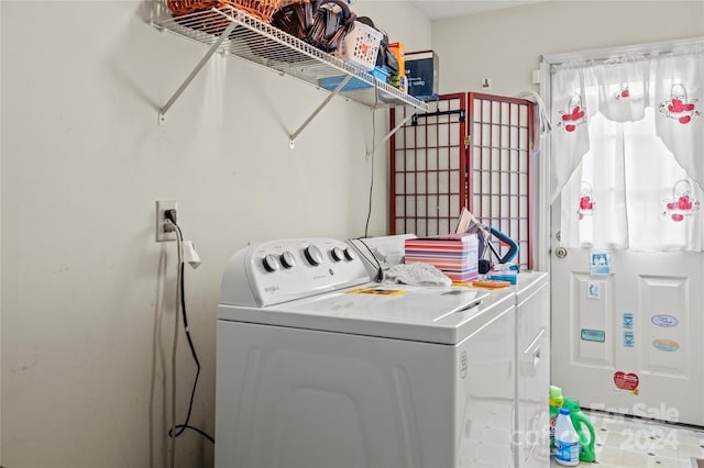 clothes washing area featuring washing machine and dryer