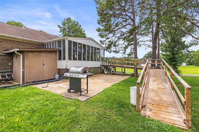 view of yard with a sunroom and a patio