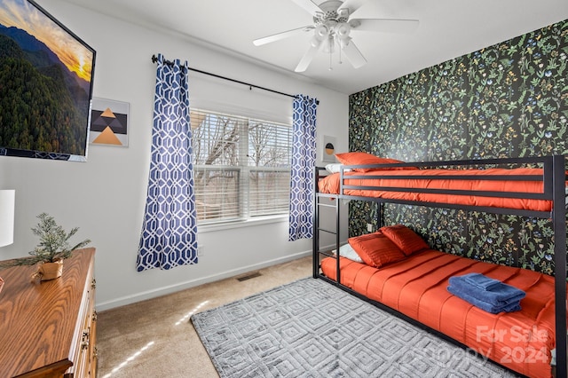 bedroom featuring ceiling fan and light carpet