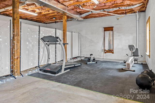 workout area featuring concrete floors