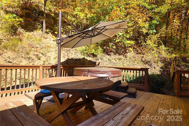 deck featuring a hot tub