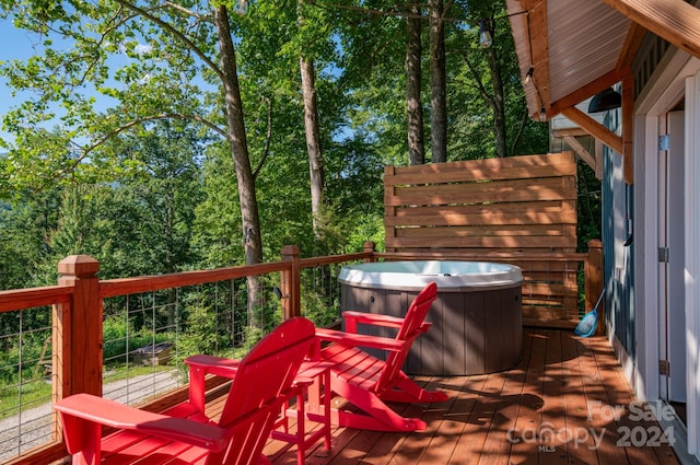 wooden terrace with a hot tub