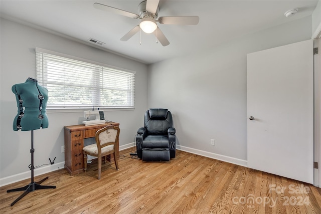 living area featuring ceiling fan and light wood-type flooring