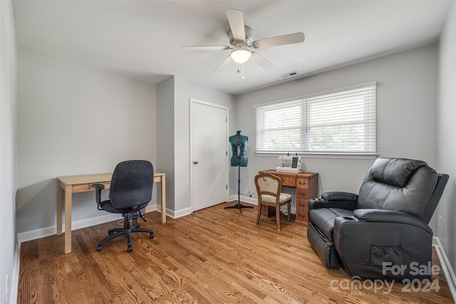 office featuring ceiling fan and light hardwood / wood-style flooring