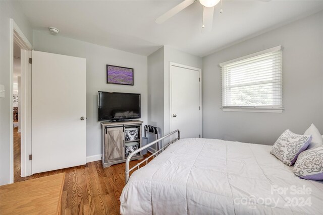 bedroom featuring hardwood / wood-style floors and ceiling fan