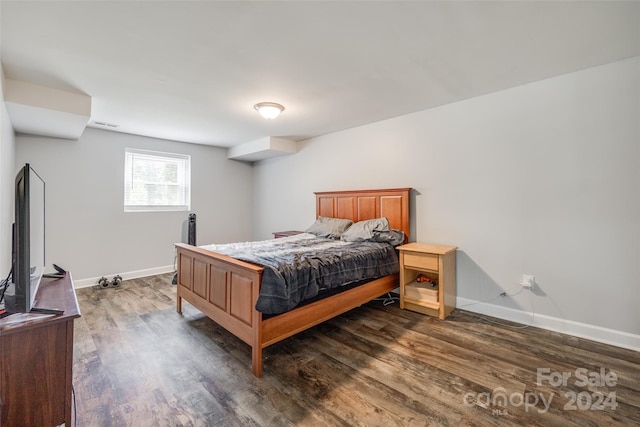 bedroom featuring dark wood-type flooring