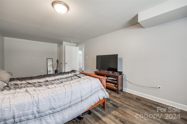 bedroom with hardwood / wood-style flooring