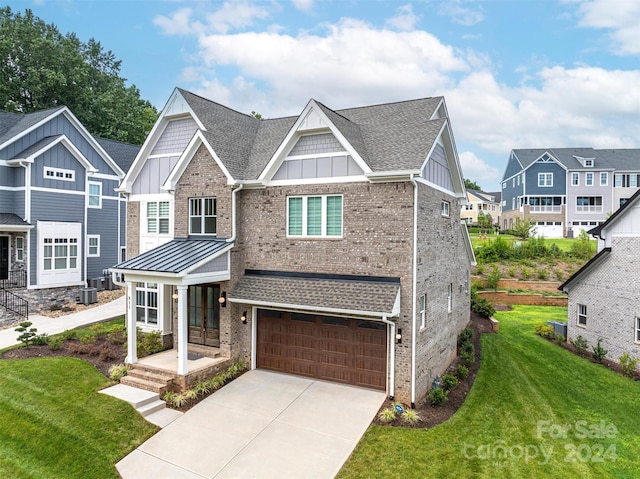 view of front facade featuring cooling unit, a garage, a front lawn, and covered porch