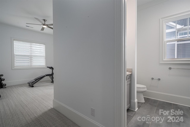 bathroom featuring vanity, ceiling fan, crown molding, and toilet