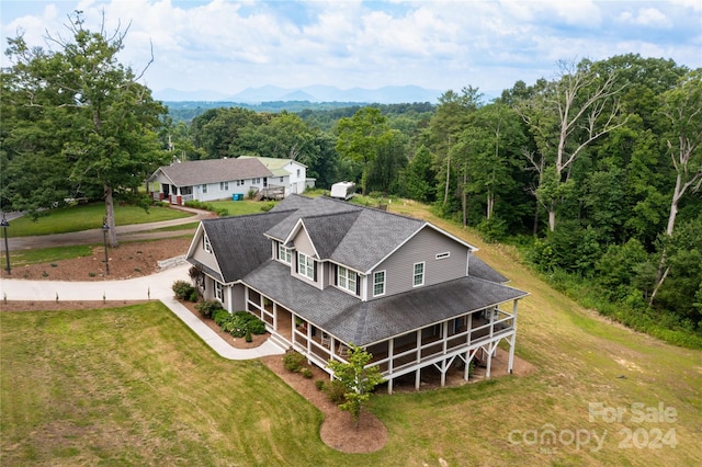 drone / aerial view featuring a mountain view