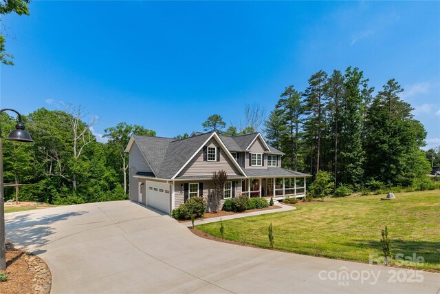 460 Panther Branch Rd, Alexander, NC 28701 - view of front of home with covered porch, a front yard, concrete driveway, and an attached garage