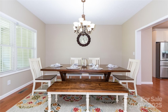 460 Panther Branch Rd, Alexander, NC 28701 - dining room with a chandelier, wood finished floors, and baseboards