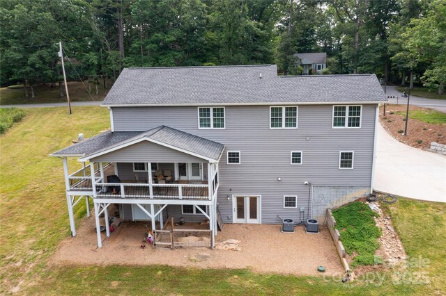 460 Panther Branch Rd, Alexander, NC 28701 - rear view of property featuring central AC unit, a shingled roof, a lawn, and a patio