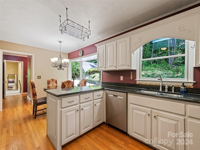 kitchen featuring stainless steel dishwasher, light wood-type flooring, white cabinetry, and sink