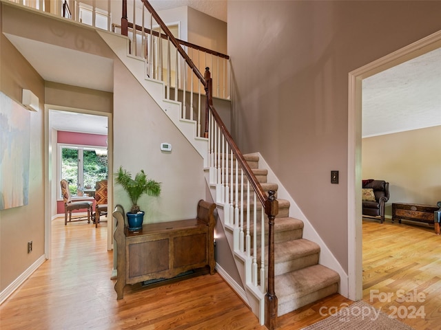 stairway featuring hardwood / wood-style flooring