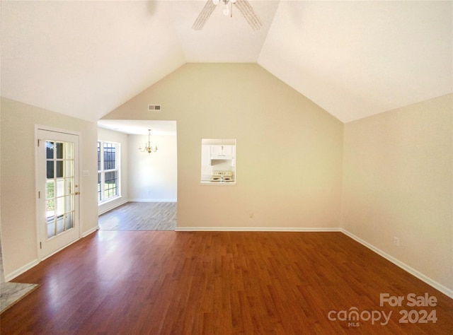 bonus room with lofted ceiling, ceiling fan with notable chandelier, and hardwood / wood-style floors