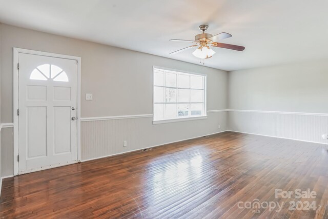 entryway with wood-type flooring and ceiling fan