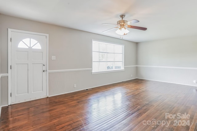 foyer entrance with ceiling fan and dark hardwood / wood-style flooring