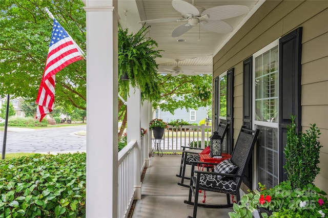 view of patio featuring ceiling fan and a porch