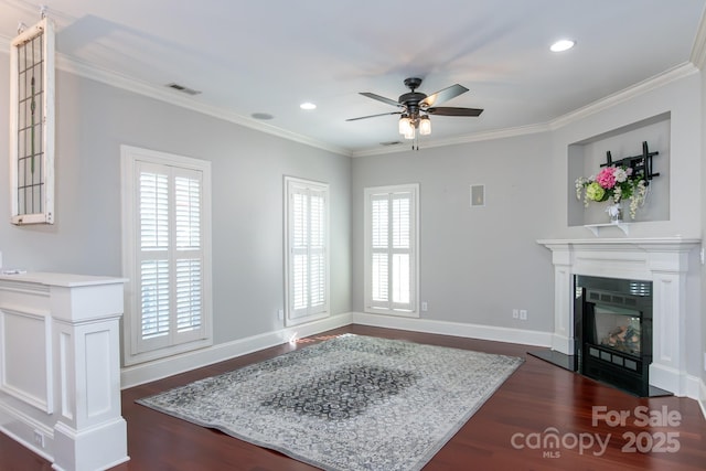 living room with ceiling fan, crown molding, and dark hardwood / wood-style floors