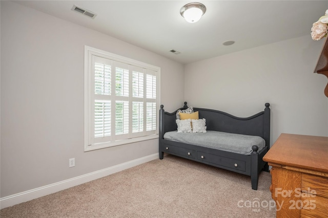 bedroom with light carpet